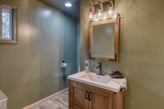 12720 E Kiowa Ct, Spokane Valley, WA 99206 - bathroom featuring wood finished floors and vanity