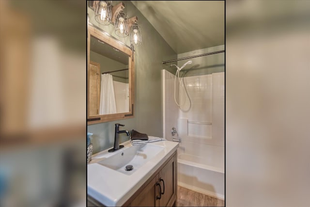 12720 E Kiowa Ct, Spokane Valley, WA 99206 - full bath with vanity, shower / bathtub combination with curtain, and wood finished floors