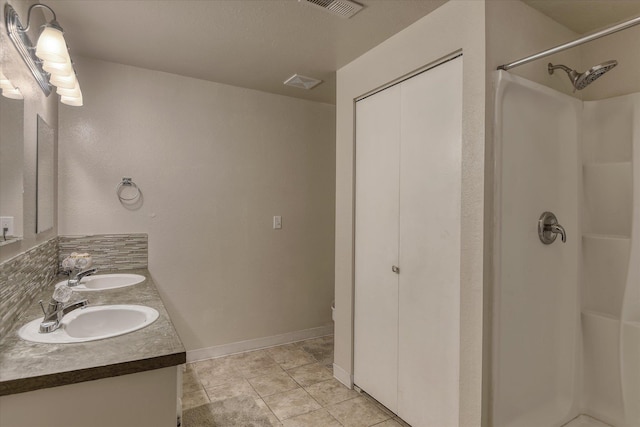12720 E Kiowa Ct, Spokane Valley, WA 99206 - full bathroom featuring double vanity and a shower