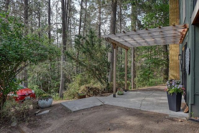 12720 E Kiowa Ct, Spokane Valley, WA 99206 - view of patio / terrace featuring a forest view and a pergola