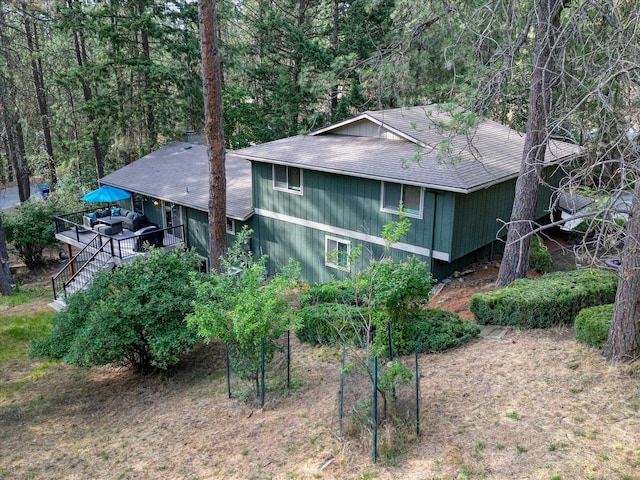 12720 E Kiowa Ct, Spokane Valley, WA 99206 - view of side of property with a deck, a shingled roof, and stairway