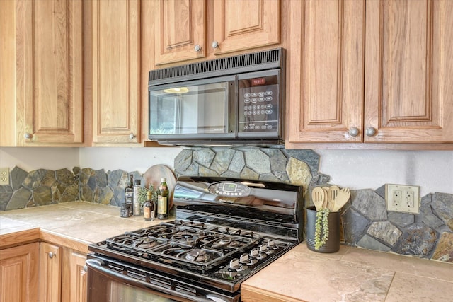 8410 N Pine Meadows Ln, Nine Mile Falls, WA 99026 - kitchen featuring black appliances, backsplash, and tile counters