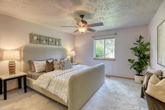 8410 N Pine Meadows Ln, Nine Mile Falls, WA 99026 - bedroom with light carpet, a ceiling fan, and a textured ceiling