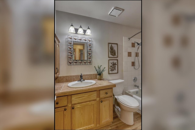 8410 N Pine Meadows Ln, Nine Mile Falls, WA 99026 - full bathroom featuring vanity, bathing tub / shower combination, and wood finished floors