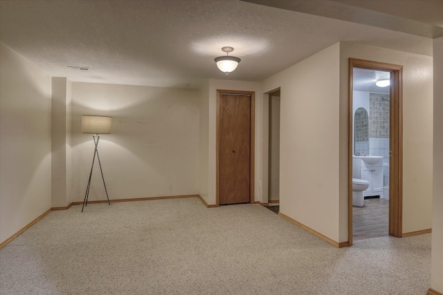 8410 N Pine Meadows Ln, Nine Mile Falls, WA 99026 - unfurnished room with a textured ceiling and baseboards