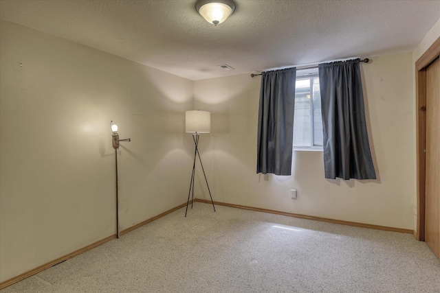 8410 N Pine Meadows Ln, Nine Mile Falls, WA 99026 - unfurnished room featuring a textured ceiling and carpet flooring