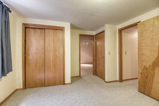 8410 N Pine Meadows Ln, Nine Mile Falls, WA 99026 - unfurnished bedroom with a textured ceiling and a closet