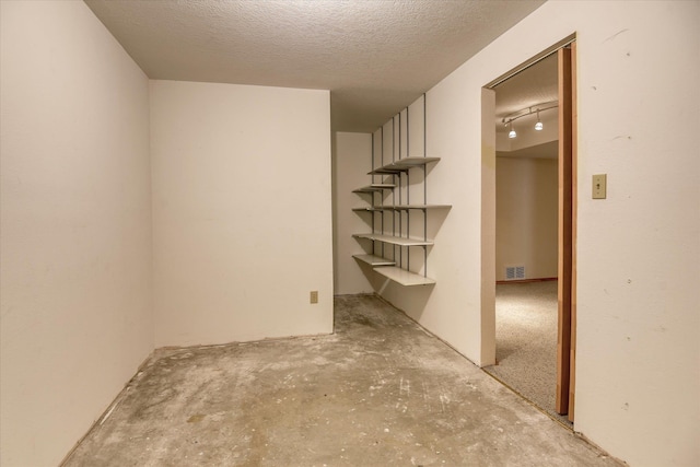 8410 N Pine Meadows Ln, Nine Mile Falls, WA 99026 - empty room with a textured ceiling