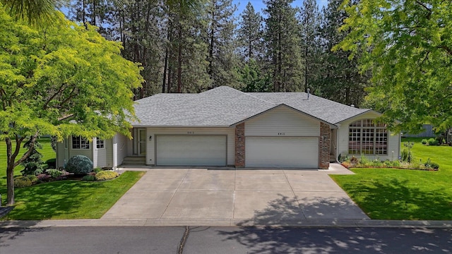 8410 N Pine Meadows Ln, Nine Mile Falls, WA 99026 - single story home featuring an attached garage, a front yard, concrete driveway, and roof with shingles