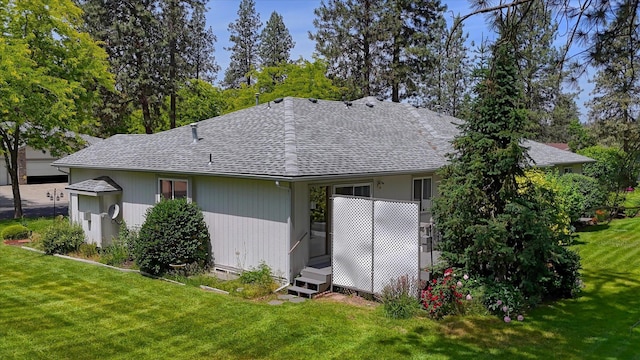 8410 N Pine Meadows Ln, Nine Mile Falls, WA 99026 - rear view of property with roof with shingles and a yard