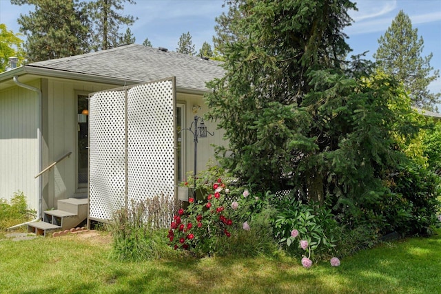 8410 N Pine Meadows Ln, Nine Mile Falls, WA 99026 - view of home's exterior featuring roof with shingles and a lawn