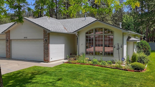8410 N Pine Meadows Ln, Nine Mile Falls, WA 99026 - single story home featuring a shingled roof, a garage, a front yard, and driveway