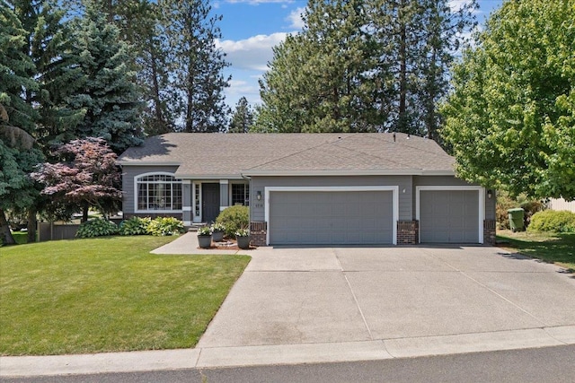 4216 S Tenfel Ln, Spokane, WA 99223 - view of front facade featuring an attached garage, brick siding, concrete driveway, and a front lawn
