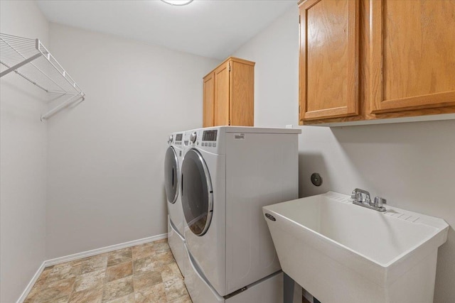 4216 S Tenfel Ln, Spokane, WA 99223 - laundry area with cabinet space, independent washer and dryer, and stone finish floors