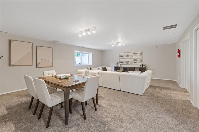 4216 S Tenfel Ln, Spokane, WA 99223 - dining room with light carpet and rail lighting