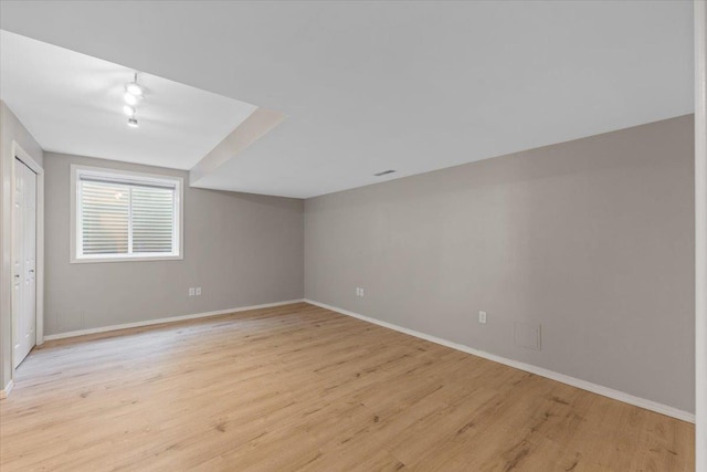 4216 S Tenfel Ln, Spokane, WA 99223 - unfurnished bedroom with light wood-type flooring and track lighting