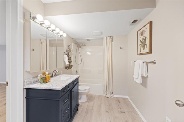 4216 S Tenfel Ln, Spokane, WA 99223 - full bathroom with wood finished floors, vanity, and shower / bathtub combination with curtain