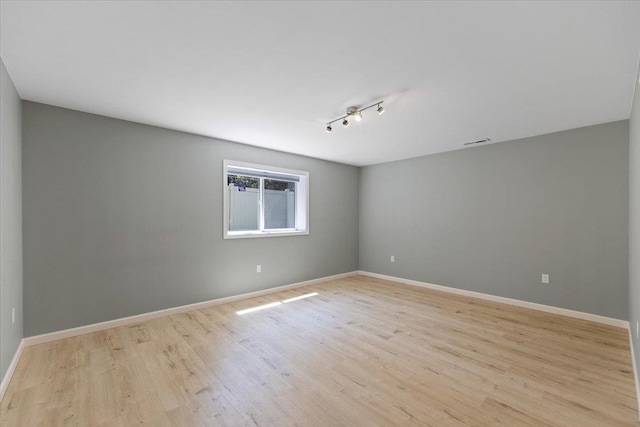 4216 S Tenfel Ln, Spokane, WA 99223 - empty room featuring light wood finished floors and baseboards