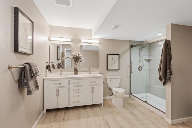 4216 S Tenfel Ln, Spokane, WA 99223 - full bath featuring double vanity, wood finished floors, and a shower stall