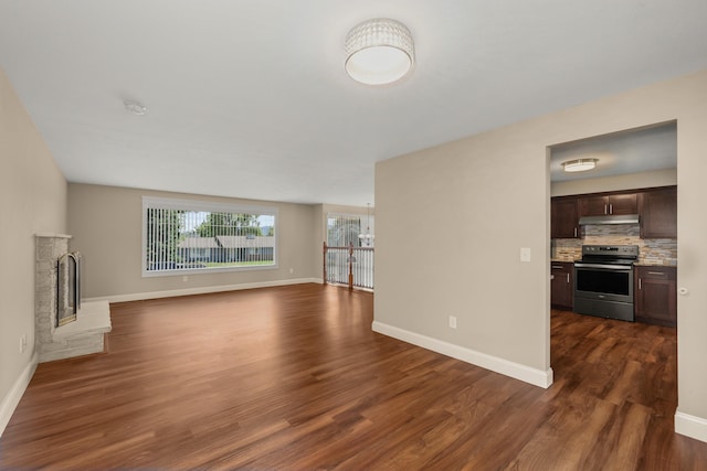 12925 E Valleyway Ave, Spokane Valley, WA 99216 - unfurnished living room with dark wood finished floors and a fireplace with raised hearth