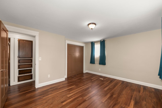 12925 E Valleyway Ave, Spokane Valley, WA 99216 - unfurnished bedroom with dark wood finished floors and a closet