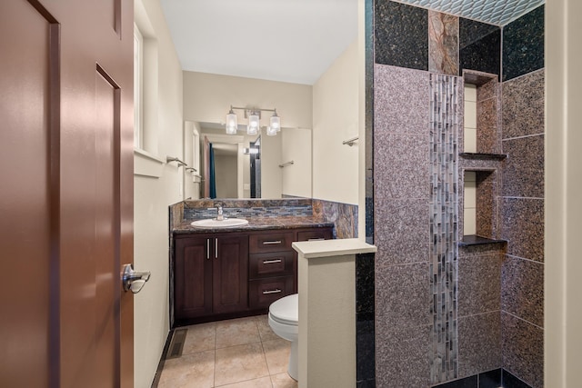 12925 E Valleyway Ave, Spokane Valley, WA 99216 - full bathroom featuring walk in shower, vanity, and tile patterned floors
