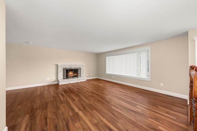 12925 E Valleyway Ave, Spokane Valley, WA 99216 - unfurnished living room featuring dark wood-style floors and a fireplace