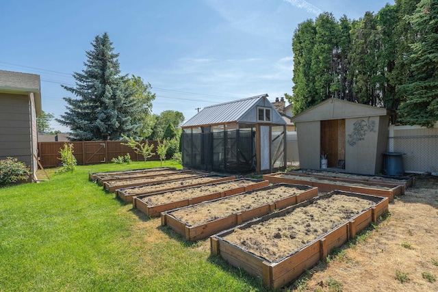 12925 E Valleyway Ave, Spokane Valley, WA 99216 - fenced backyard with a vegetable garden, a greenhouse, and a storage shed