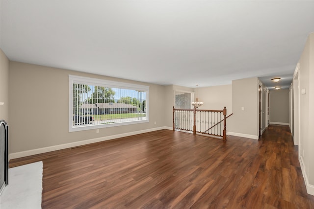 12925 E Valleyway Ave, Spokane Valley, WA 99216 - unfurnished living room with a chandelier and dark wood finished floors