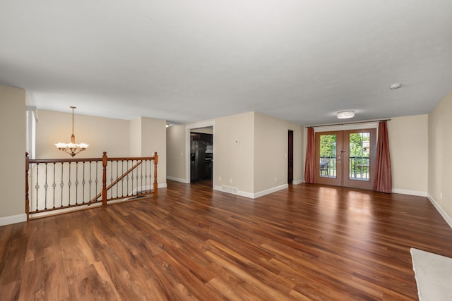 12925 E Valleyway Ave, Spokane Valley, WA 99216 - unfurnished room featuring a chandelier and wood finished floors