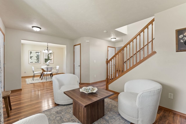12919 E 39th Ln, Spokane Valley, WA 99206 - living room with stairway, dark wood finished floors, and a chandelier