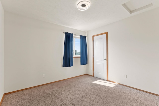 12919 E 39th Ln, Spokane Valley, WA 99206 - carpeted empty room with attic access and baseboards
