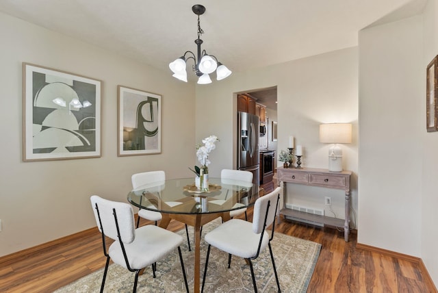 12919 E 39th Ln, Spokane Valley, WA 99206 - dining area featuring a chandelier and dark wood finished floors
