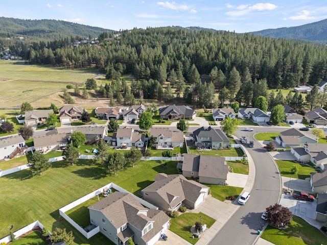 12919 E 39th Ln, Spokane Valley, WA 99206 - aerial perspective of suburban area featuring a heavily wooded area and a mountain backdrop