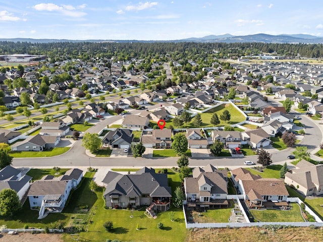 12919 E 39th Ln, Spokane Valley, WA 99206 - aerial overview of property's location with a mountain backdrop and nearby suburban area