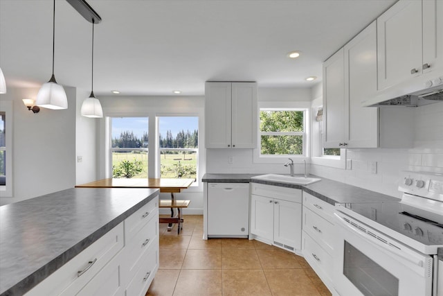 4669 Williams Valley Rd Unit D, Clayton, WA 99110 - kitchen featuring white appliances, under cabinet range hood, dark countertops, light tile patterned floors, and white cabinetry