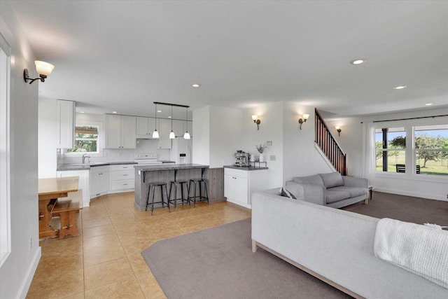 4669 Williams Valley Rd Unit D, Clayton, WA 99110 - living room featuring light tile patterned floors, healthy amount of natural light, and recessed lighting