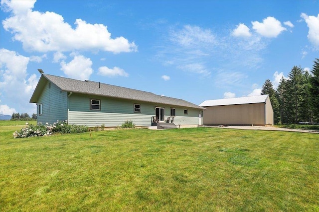 34225 N Arlington Ln, Deer Park, WA 99006 - back of property with a lawn and an outbuilding