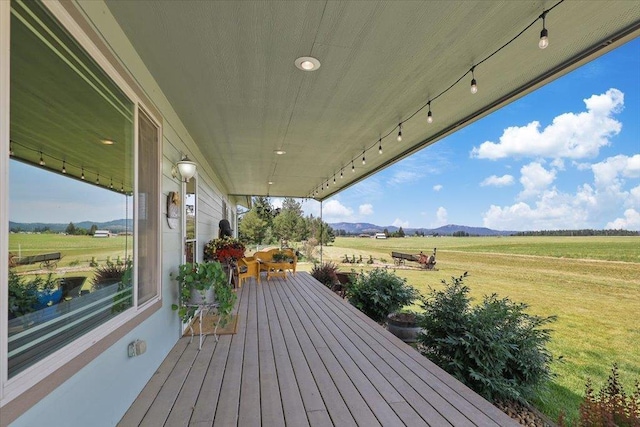 34225 N Arlington Ln, Deer Park, WA 99006 - wooden deck featuring a mountain view, a rural view, and a yard