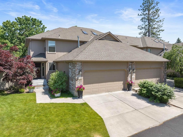 3001 S Winthrop Ln, Spokane, WA 99203 - view of front of property featuring an attached garage, concrete driveway, roof with shingles, and a front lawn