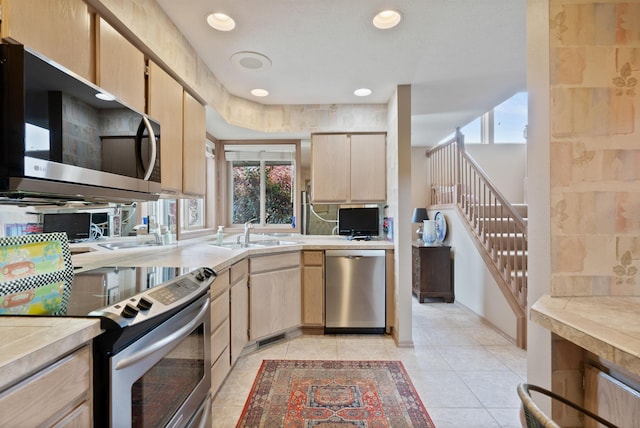 3001 S Winthrop Ln, Spokane, WA 99203 - kitchen featuring appliances with stainless steel finishes, light brown cabinetry, light countertops, plenty of natural light, and recessed lighting