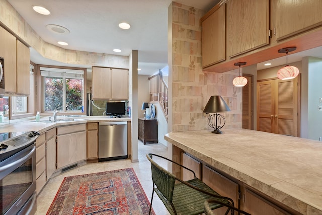 3001 S Winthrop Ln, Spokane, WA 99203 - kitchen with stainless steel appliances, backsplash, light countertops, decorative light fixtures, and recessed lighting