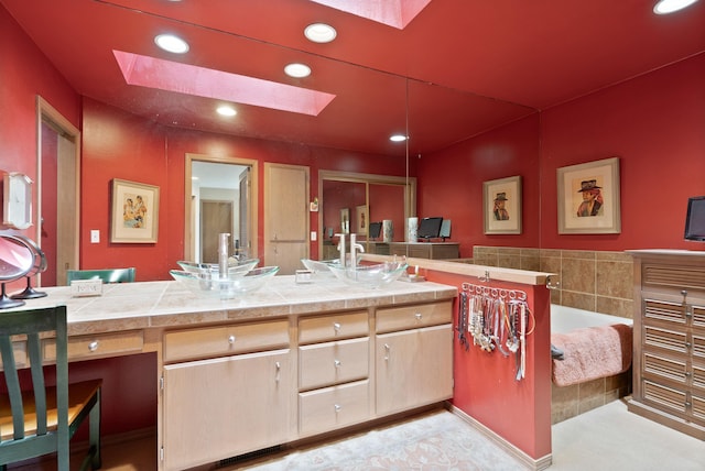3001 S Winthrop Ln, Spokane, WA 99203 - kitchen featuring a skylight, recessed lighting, light countertops, and light brown cabinets
