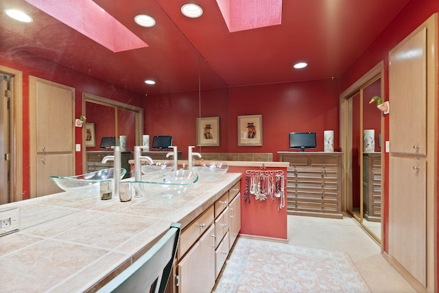 3001 S Winthrop Ln, Spokane, WA 99203 - kitchen featuring tile countertops, a skylight, and recessed lighting