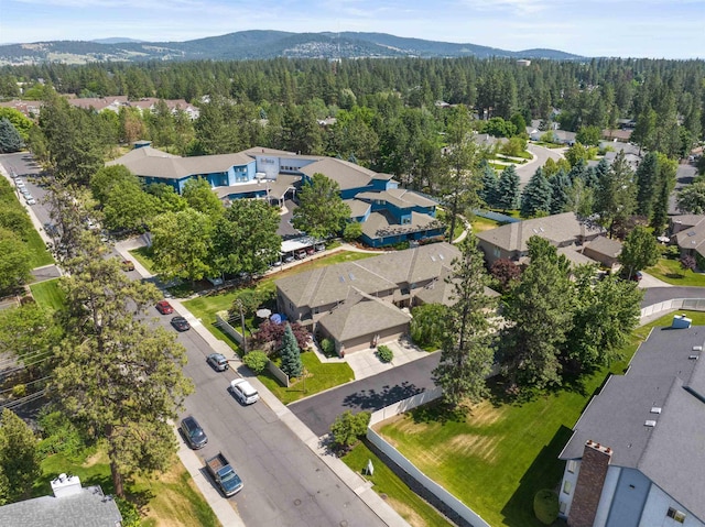 3001 S Winthrop Ln, Spokane, WA 99203 - aerial perspective of suburban area featuring a heavily wooded area and mountains
