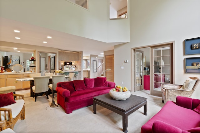 3001 S Winthrop Ln, Spokane, WA 99203 - living area with light carpet, recessed lighting, stairway, and a towering ceiling