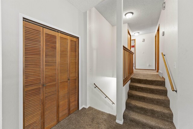 3114 W 20th Ave, Spokane, WA 99224 - stairs with carpet flooring and a textured ceiling