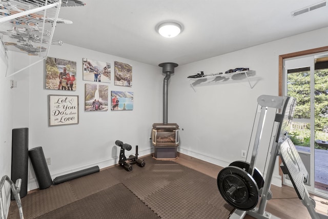 3114 W 20th Ave, Spokane, WA 99224 - workout room with a wood stove and wood finished floors