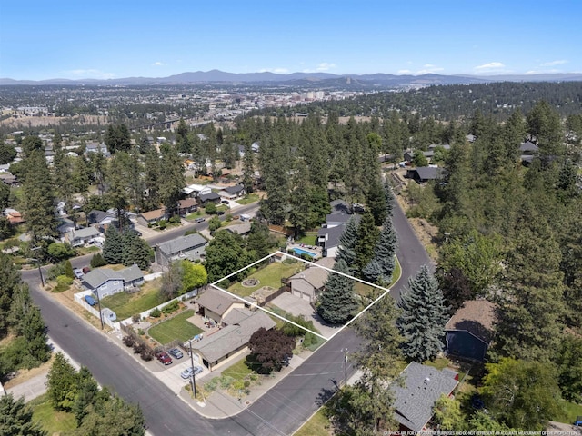 3114 W 20th Ave, Spokane, WA 99224 - aerial view of residential area with a mountainous background and property parcel outlined