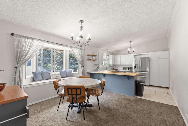 3114 W 20th Ave, Spokane, WA 99224 - dining room with a chandelier, light carpet, a textured ceiling, lofted ceiling, and light tile patterned floors